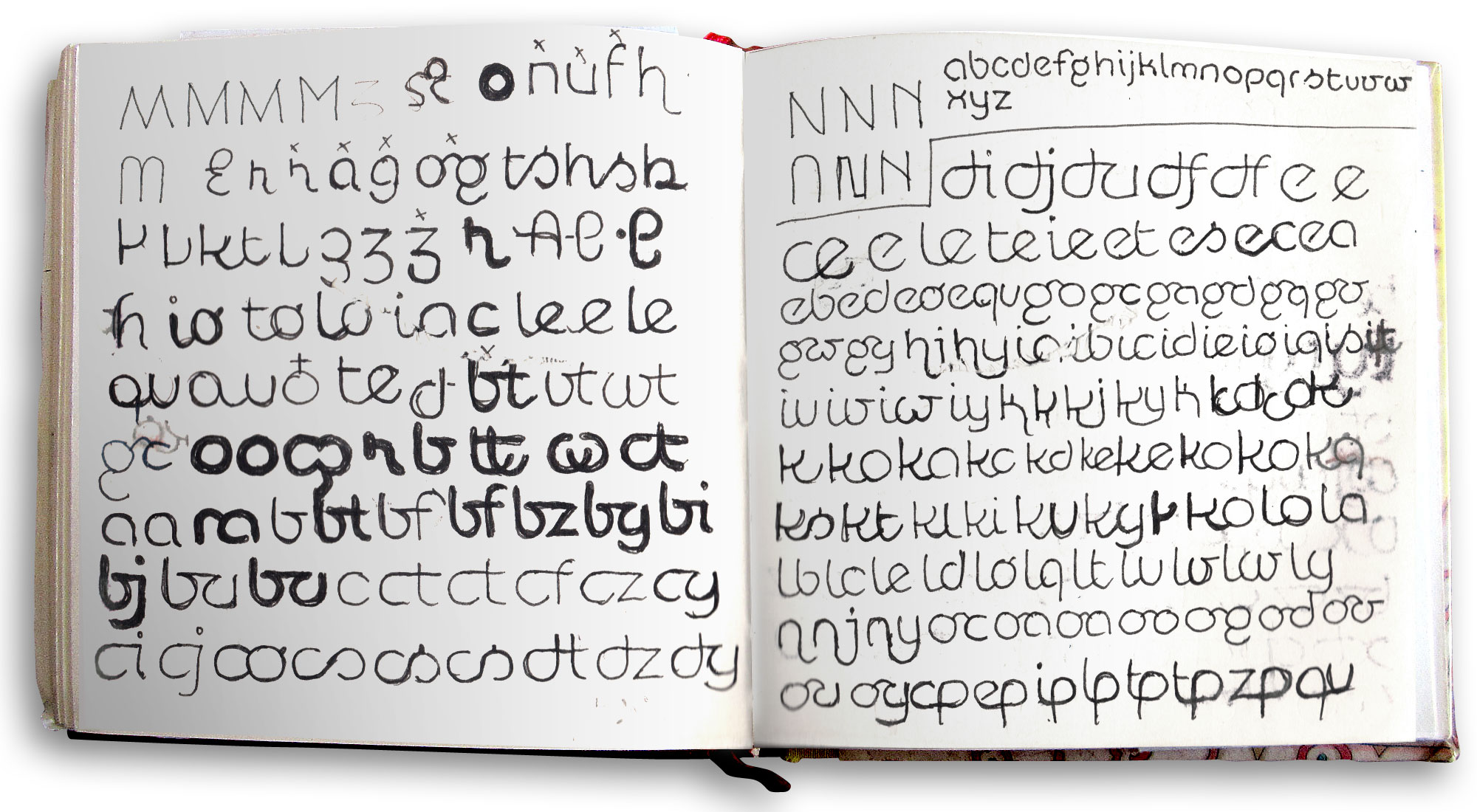 Manual sketches of letters in a sketchbook